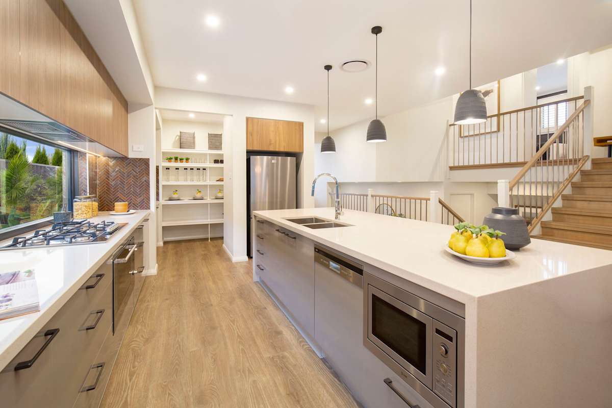 Trilogy house design kitchen staircase